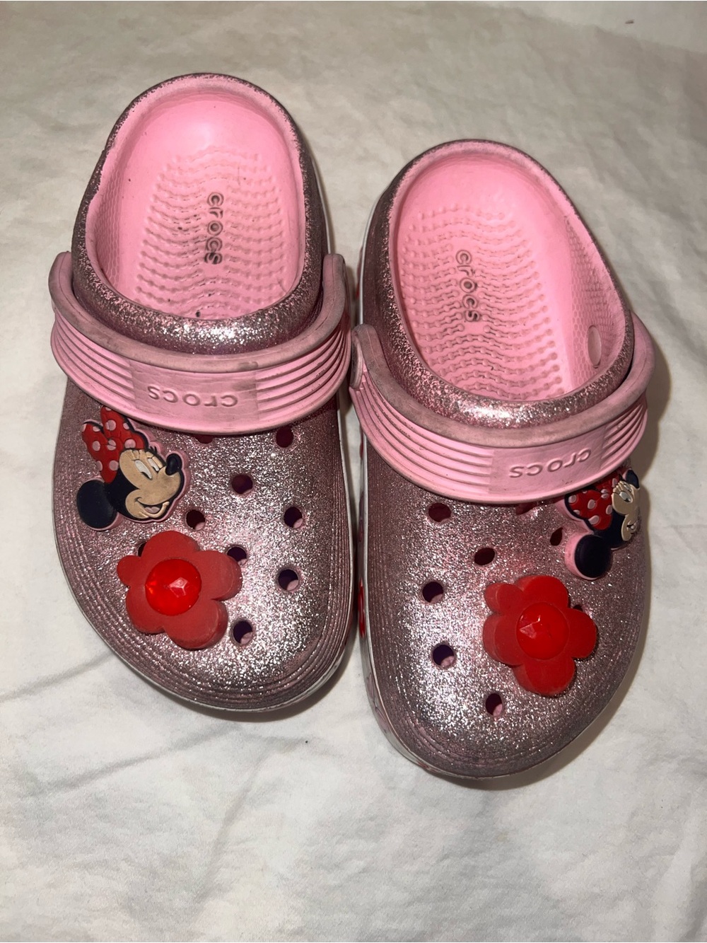 CROCS Kids' Pink Glitter Clogs with Red Flower & Minnie Charms